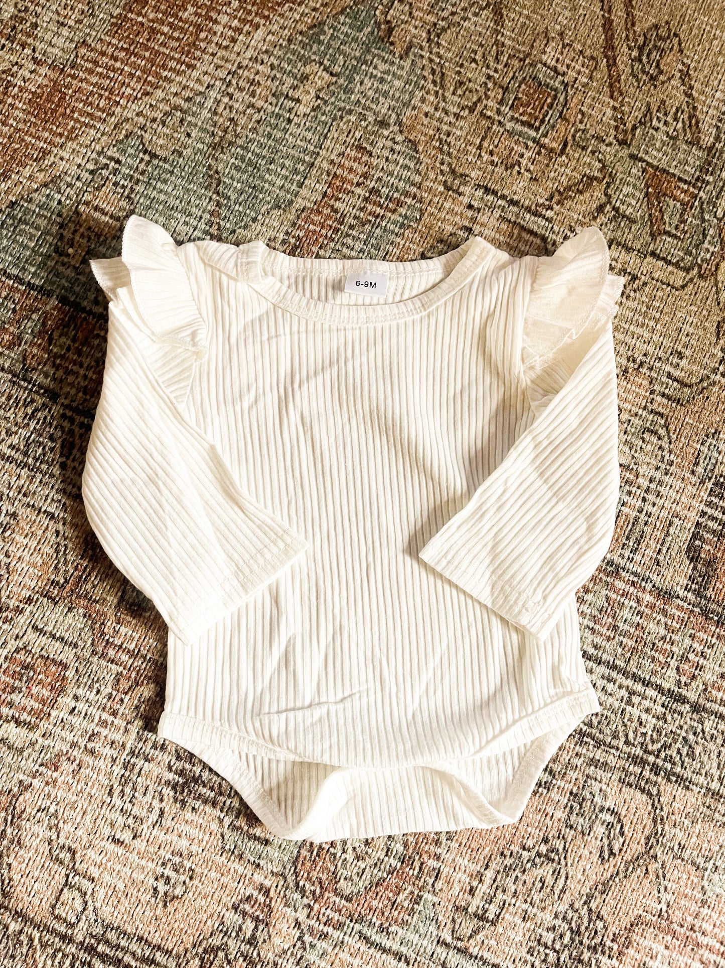 Ruffle sleeve onesie