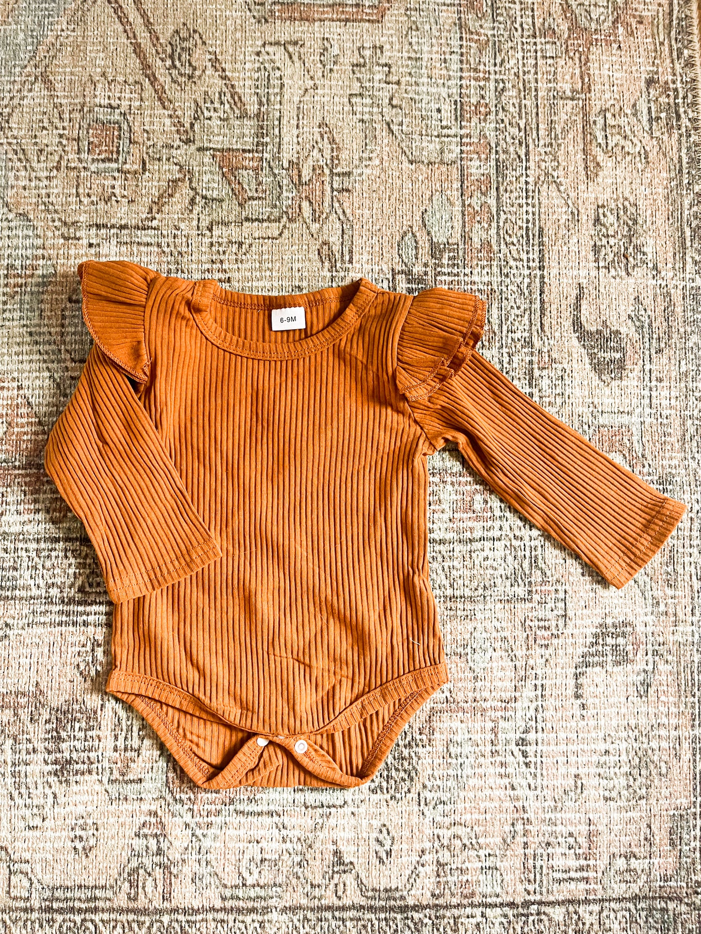 Ruffle sleeve onesie