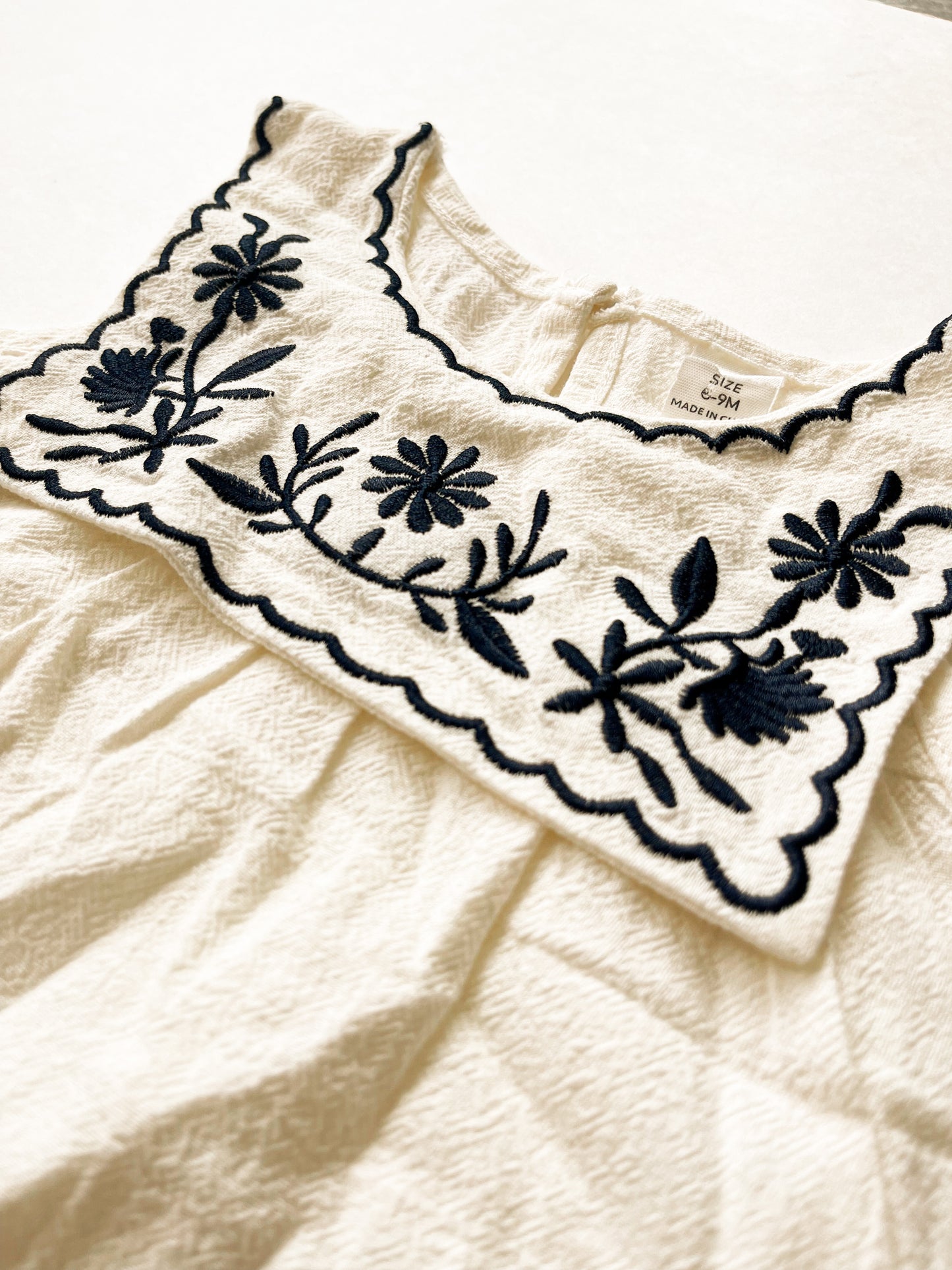 White Embroidered onesie